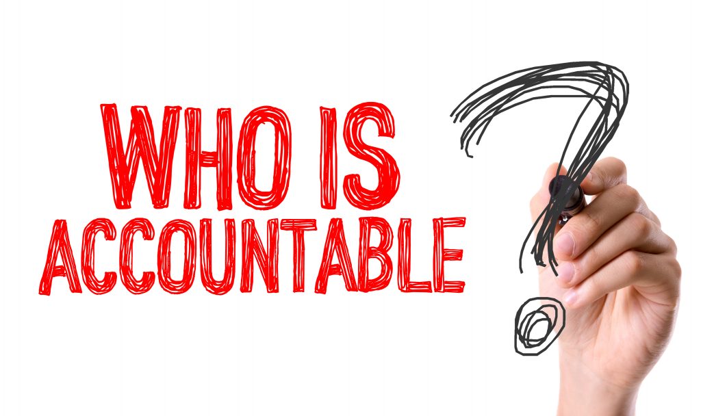 Hand writes who is accountable question mark, compliance, ISO31030